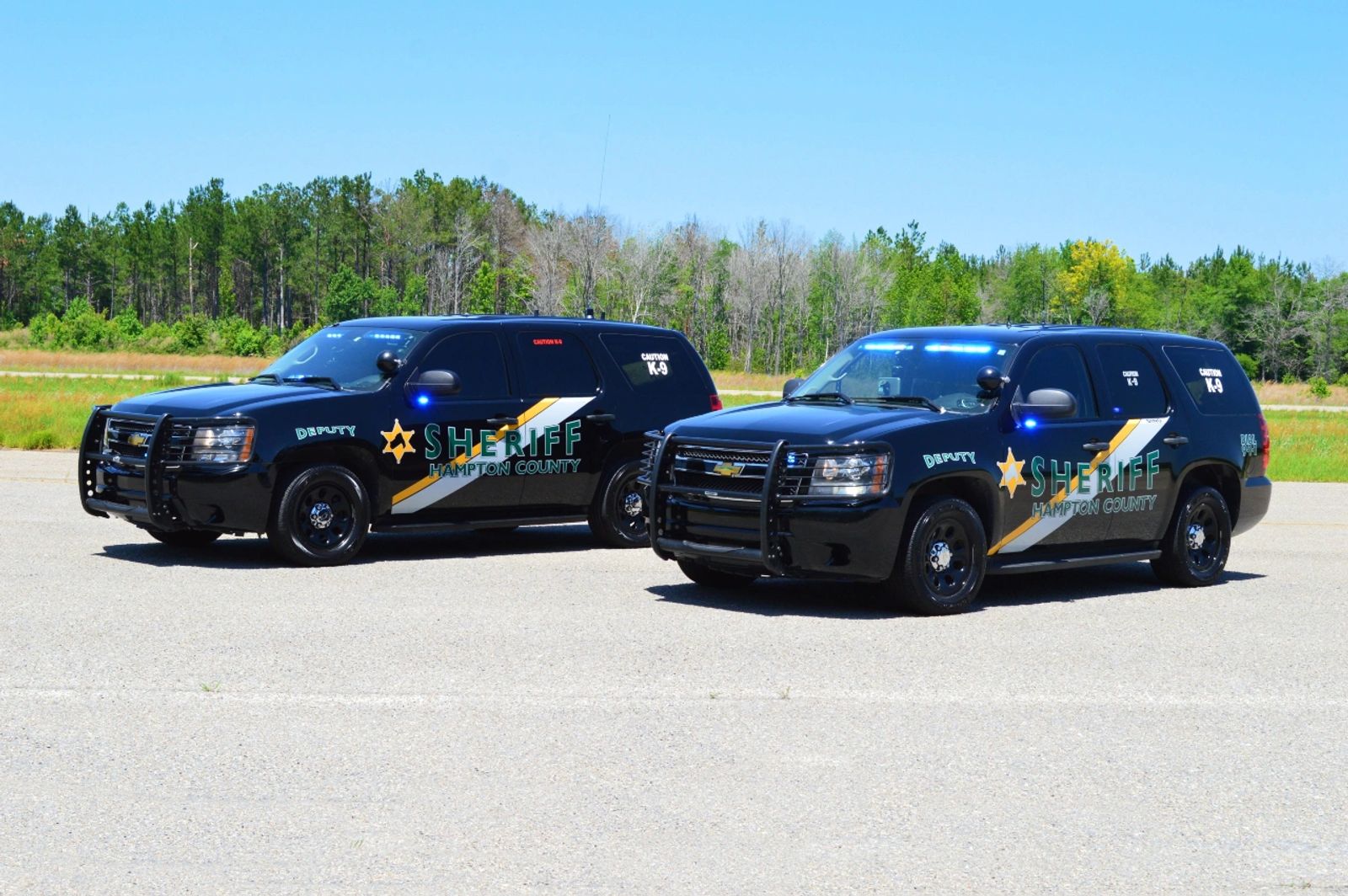 Two Hampton County Sheriff patrol vehicles parked side by side